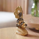 Statue de femme africaine assis