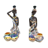 Statue de femme africaine assise