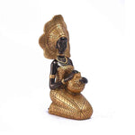Statue femme Afrique en or
