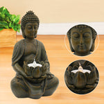 Statue Bouddha avec bougie