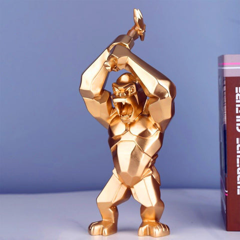 Statue dorée de gorille décoration