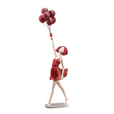 Statue femme avec ballons