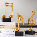 Statues décoration musique dorées